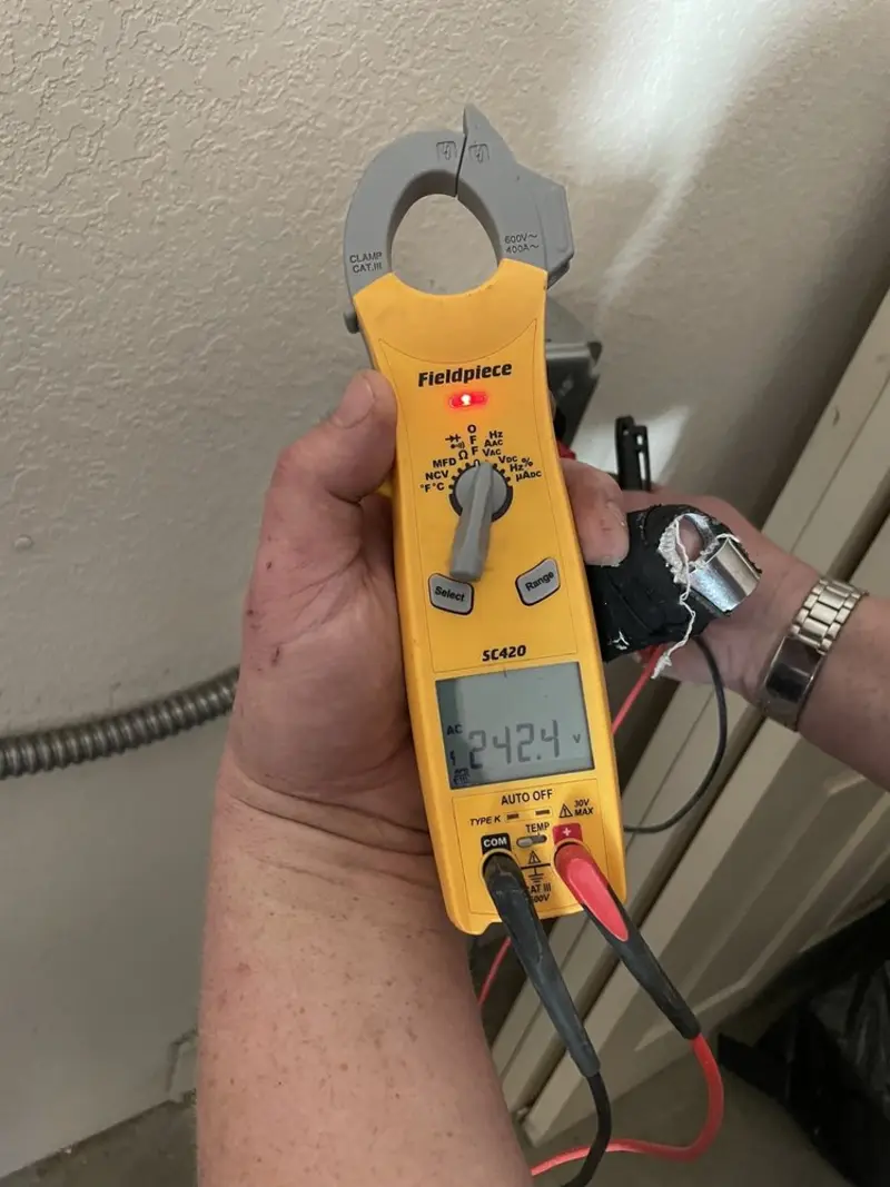 Voltage testing with clamp meter during Hot Tub / Pool Electrical Wiring in Limington